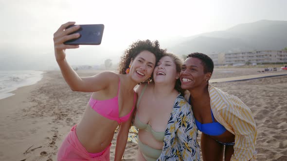 young women having fun on the beach