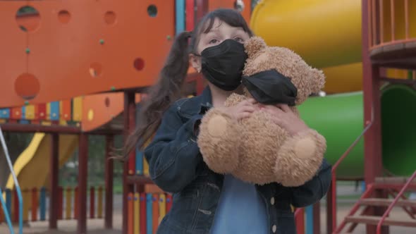 Child play with toy on playground in quarantine. 