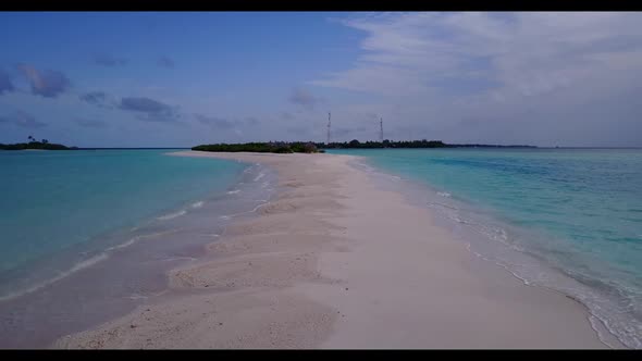 Aerial seascape of tranquil shore beach time by blue water and clean sandy background of a dayout ne