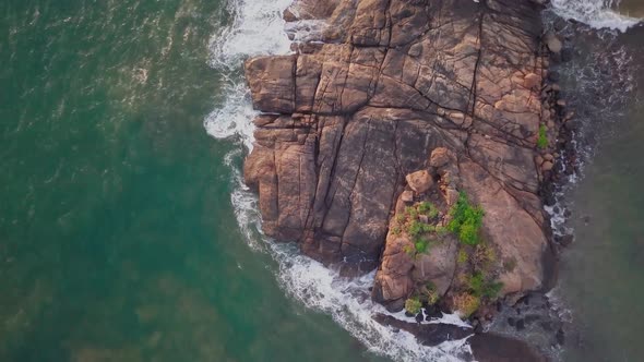 Beautiful Rocky Island. Ocean Waves Break Off the Shore