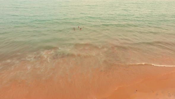 Aerial view of people swimming in sea in Brazil.