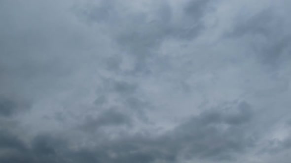 Gray Rain Clouds Are Moving in the Sky. TimeLapse