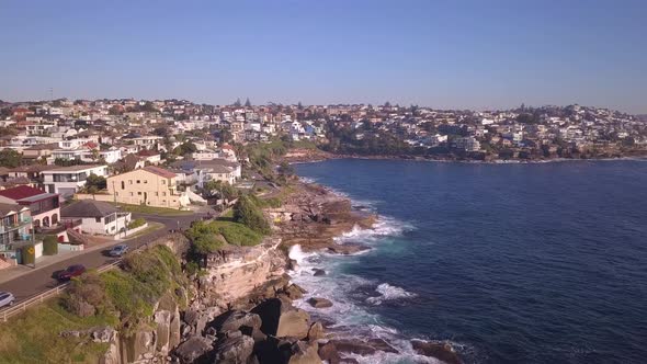 Aerial drone flying over Australian coastal houses in Sydney