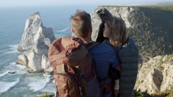 Strong Dad with Camping Backpack Hugging Daughter Kid