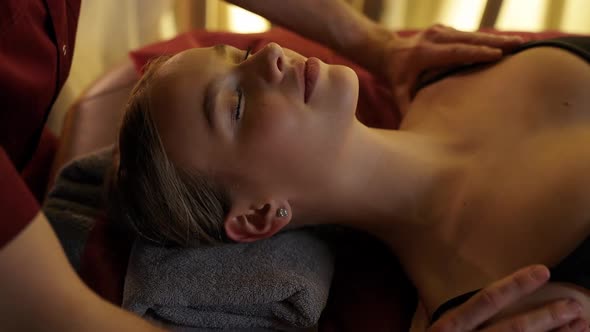 Professional Masseur Gives a Relaxing Neck Massage to a Young Female Spa Treatments Wellness