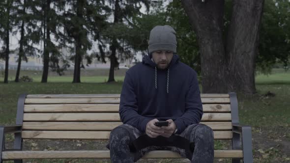 Sportive man listening music outdoors