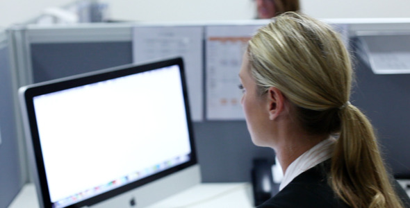 Girl Working in Office at Computer Typing