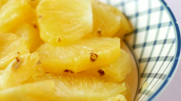 Slice of Pineapple in Bowl on Table