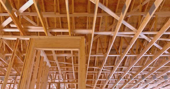 Wood Frame House Under Construction in Suburban New Stick Beams Built with Wall