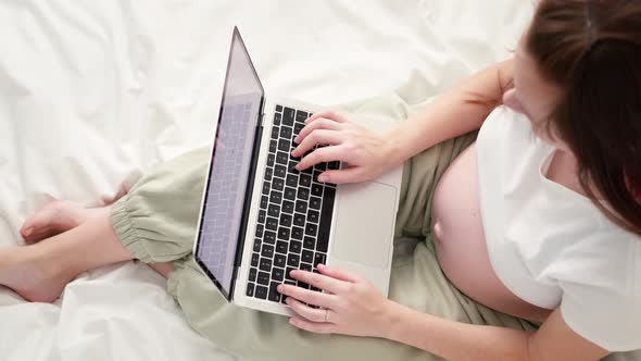 Top View Expectant Mother Working Remotely Online From Home