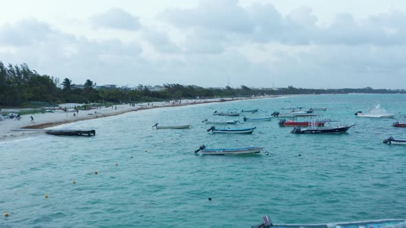 Drone Flying Above Moored Boats at the Seashore at Playa Del Carmen Mexico