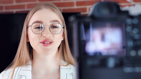 Closeup Smiling Face of Beautiful Young Girl Blogger Talking Recording Using Professional Camera