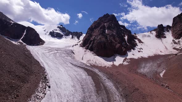 High Rocky Mountains Covered with Ice in Places