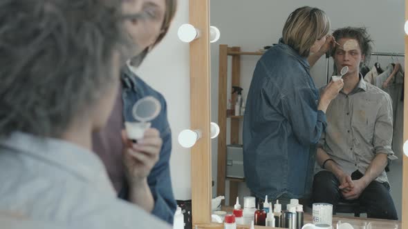 SFX Makeup Artist Working with Actor for Horror Movie