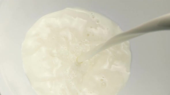 Milk Pours Into Mixing Bowl