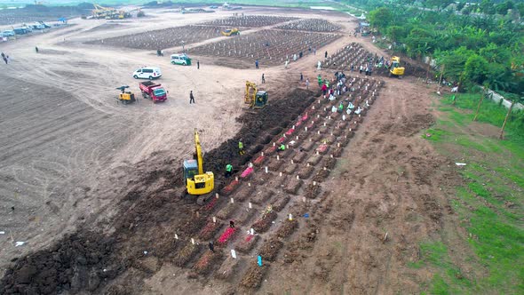 Funeral procession at Jakarta. Special graves infected with the corona virus