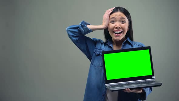 Girl Holding Laptop With Green Screen, Crazy About Discounts, Shopping Online