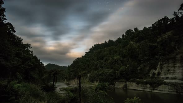 Clouds Sky Moving Fast over Whanganui Fiver in Dark Evening with Stars in New Zealand Nature