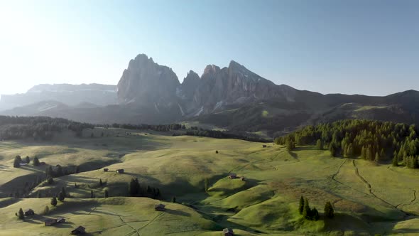 Flying Backwards Above Blooming Fields Meadows at Alpe di Suisi in Dolomites Italy