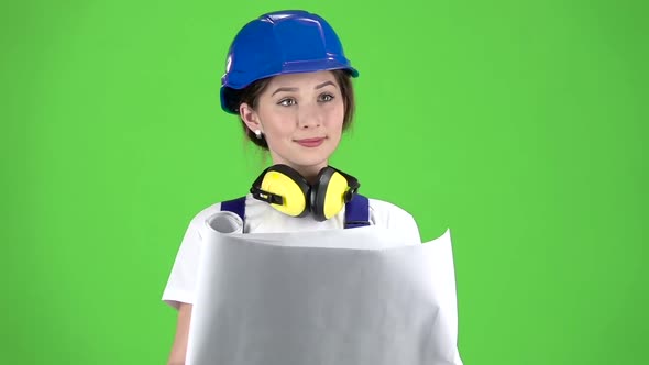 Engineer of the Construction Site Carries a Drawing. Green Screen. Slow Motion