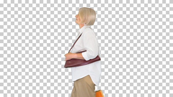 Granny wealthy lady walking by with shopping bags, Alpha Channel