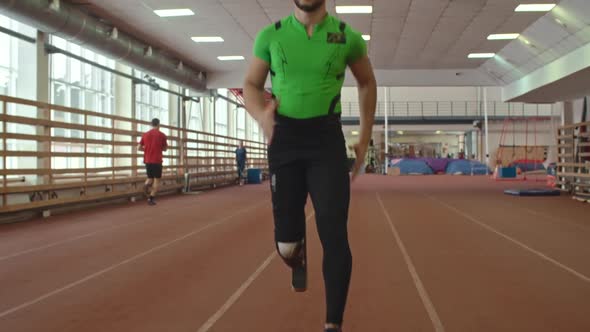 Amputee Athlete Running on Track