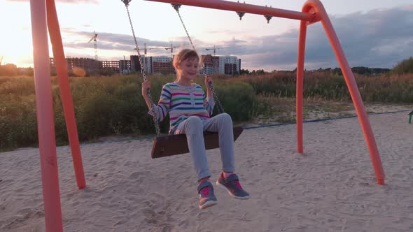 Girl On Swing Jumps