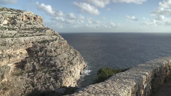 Mediterranean Sea Washes Shores of Hill Near Blue Grotto on Winter Day in Malta