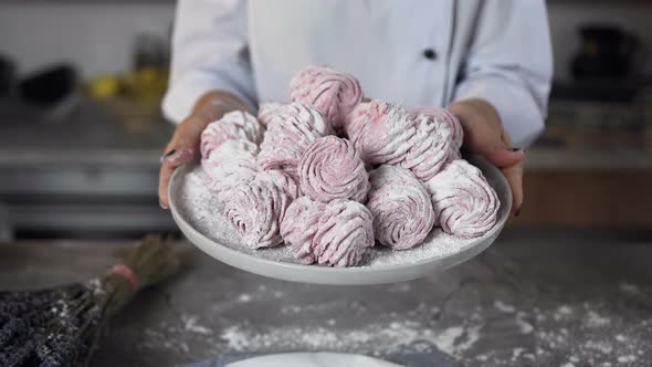 Macaroons in Female Hands