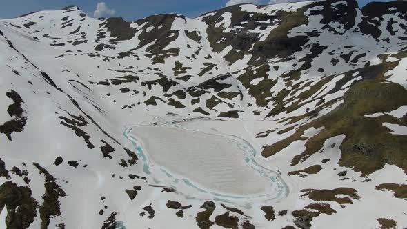 Drone shot of Bachalpsee lake, near First mountain over Grindelwald, Switzerland