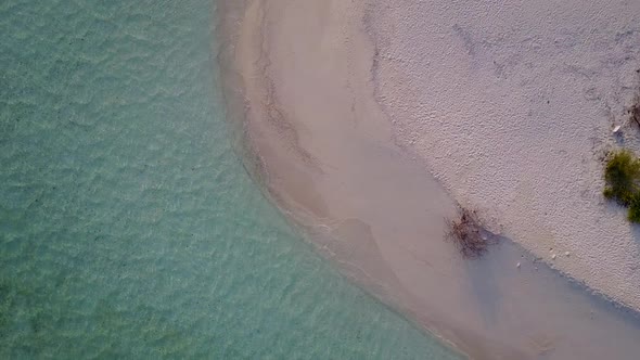 Daytime tourism of lagoon beach by blue ocean with sand background near sandbar