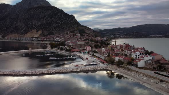 Egirdir Lake and Town Located on Long Narrow Peninsula with Docks and Moored Ships Filmed By Drone