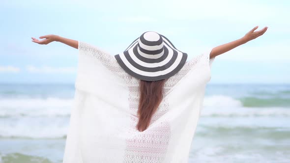 Asian woman enjoy around beautiful beach sea ocean