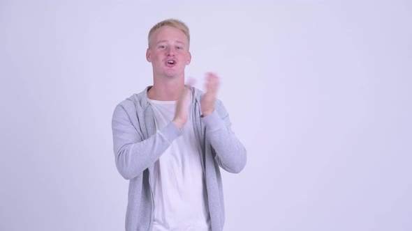 Happy Young Blonde Handsome Man Clapping Hands