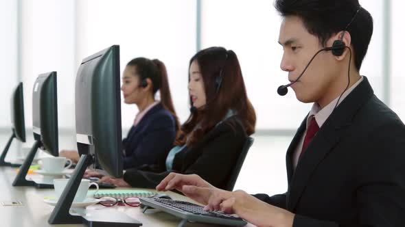 Business People Wearing Headset Working in Office