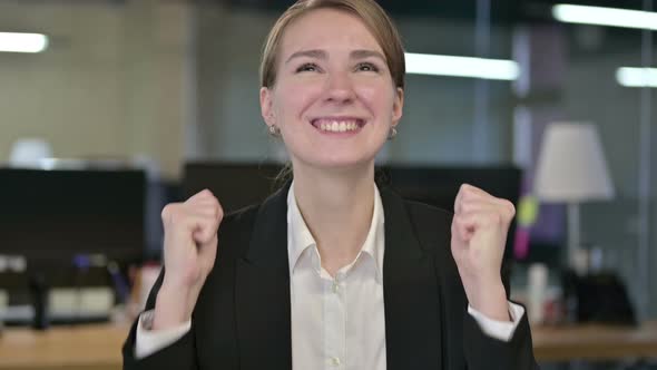 Portrait of Excited Young Businesswoman Celebrating Success