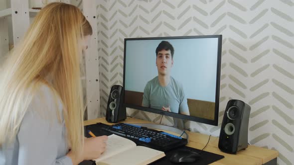 Young Student Watching Lesson Online and Studying From Home