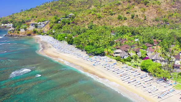 Aerial Drone View White Fisherman Boats on the White Sand Beach in Amed, Bali, Indonesia. Showing