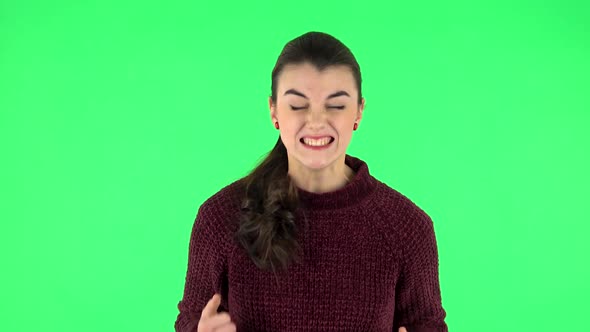 Portrait of Annoyed Woman Gesturing in Stress Expressing Irritation and Anger. Green Screen