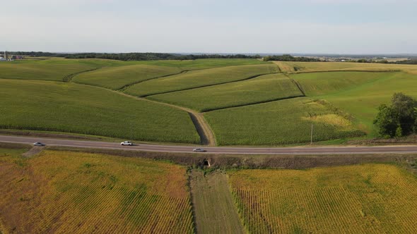 Cars passing by on a freeway on the country side in south Minnesota aerial view