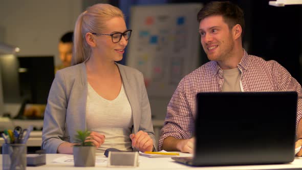 Business Team Making High Five at Night Office