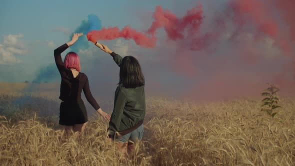 Females Enjoying Outdoor Leisure with Smoke Bombs