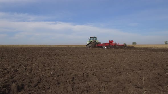 Tractor Plowing Field