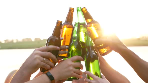 Group of friends partying on the beach - Young people celebrating during summer vacation