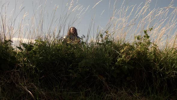 A lone knight and his battle cry of. Wide shot.