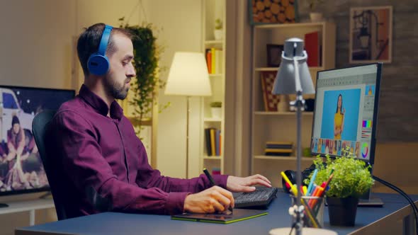 Creative Man Listening Music on Headphones