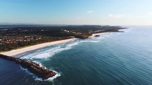 Drone flying forward showing Lighthouse beach, Shelly Beach and coastline. Ballina, Australia.