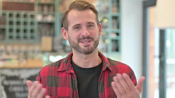 Portrait of Video Chat By Cheerful Young Man 