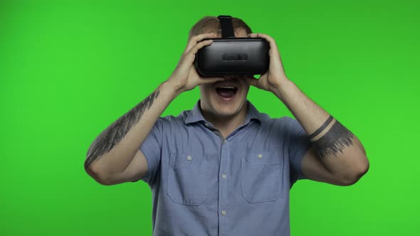 Man Using VR Headset Helmet To Play Game. Watching Virtual Reality 3d 360 Video. Chroma Key