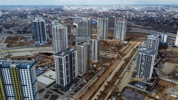 Drone fly over construction site with tower cranes